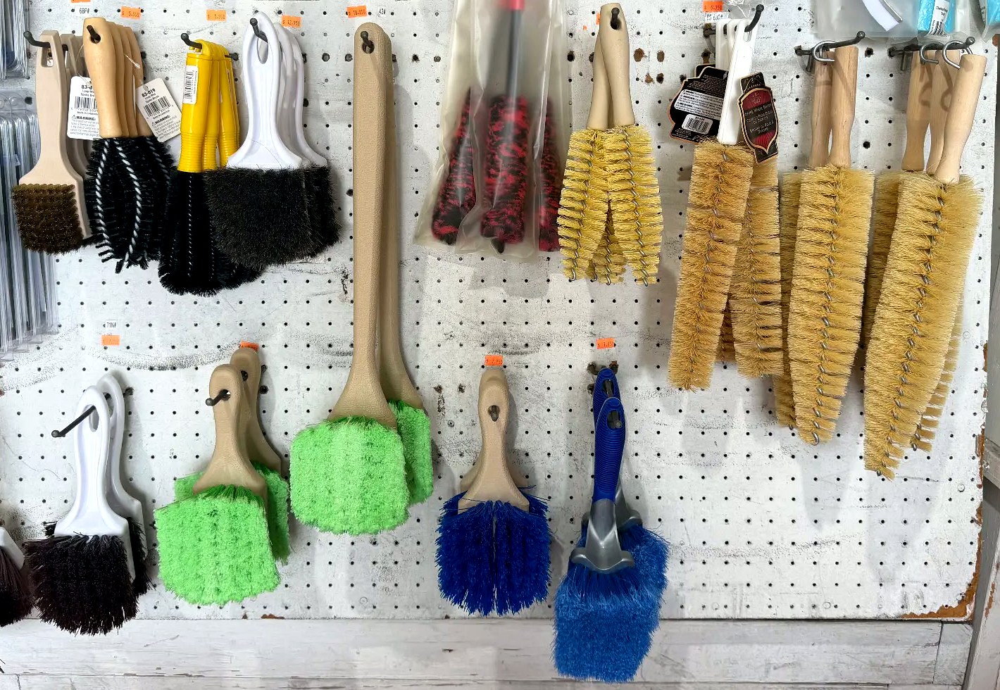 In-store display of wheel, tire and cleaning brushes at Expert Detail Supply